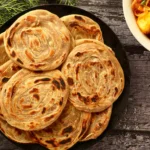 ঘি দিয়ে পরোটা রান্না করছেন? আপনার স্বাস্থ্যের ক্ষতি করে এমন এই ভুলটি করা বন্ধ করুন।